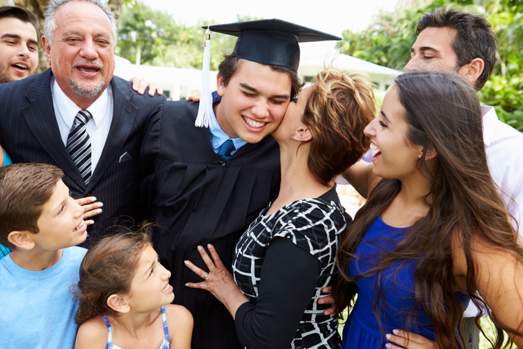 Hispanic Student And Family Celebrating Graduation Hispanic Student And Family Celebrating Graduation